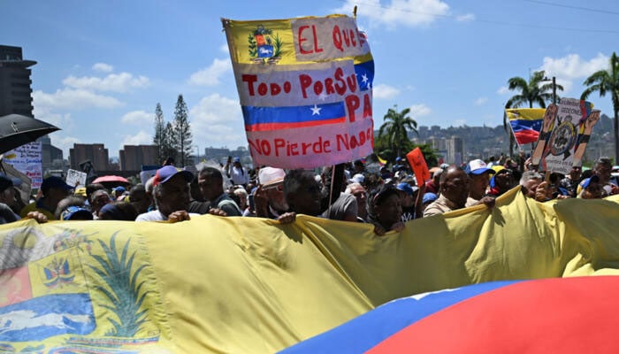 Opponents to the government of Venezuelan interim President Delcy Rodriguez demonstrate demanding salary and pension raises in Caracas on April 9, 2026. — AFP