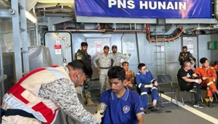 Pakistan Navy personnel attend to crew of a merchant vessel aboard PNS HUNAIN after their rescue in the North Arabian Sea on April 10, 2026. — ISPR