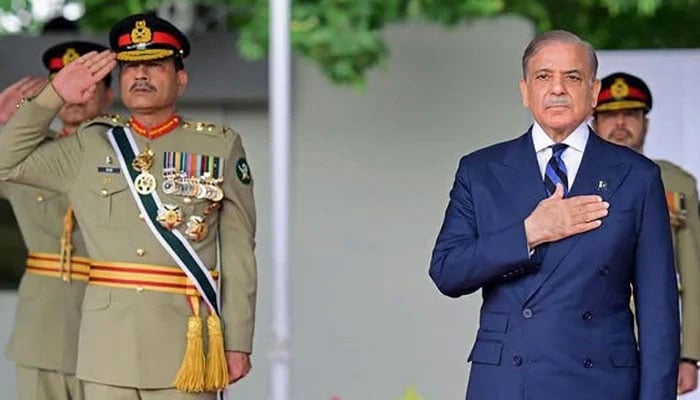Prime Minister Shehbaz Sharif (right) and Army Chief Field Marshal Asim Munir review a passing out parade at the Pakistan Military Academy (PMA) Kakul, in Abbottabad on April 26, 2025. —AFP