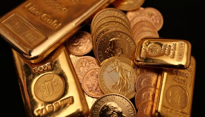 UK gold bars and gold Sovereign coins are displayed at Baird & Co in Hatton Garden in London, Britain, October 8, 2025. — Reuters