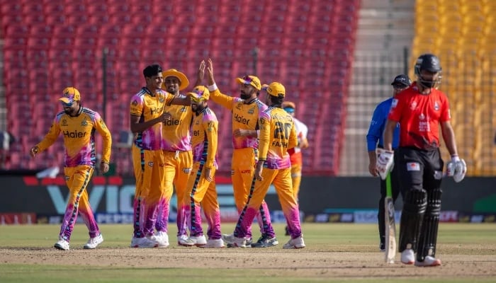 Peshawar Zalmi pacer Nahid Rana celebrates after taking wicket with teammatesduring their Pakistan Super League (PSL) 11 match against Lahore Qalandars at the National Bank Stadium in Karachi on April 11, 2026. — PSL