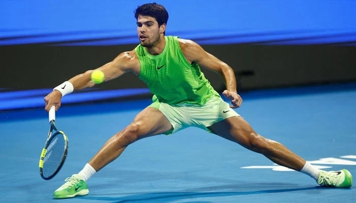 Spains Carlos Alcaraz hits a return against Russias Andrey Rublev during their mens singles semi-final match at the Qatar Open tennis tournament in Doha on February 20, 2026. — AFP