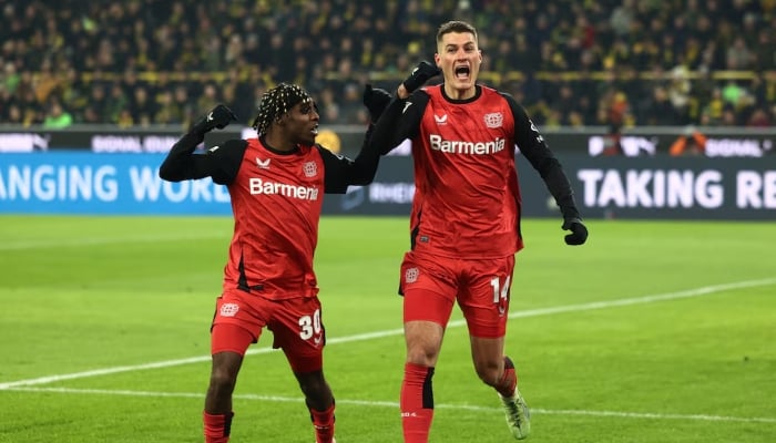 Bayer Leverkusens Patrik Schick celebrates scoring their second goal with Jeremie Frimpong. —Reuters/File