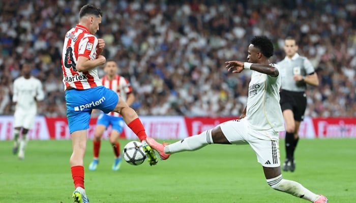 Real Madrid’s Vinicius Junior vies for the ball with Girona’s Arnau Martinez during the Spanish league football match at the Santiago Bernabeu stadium in Madrid, Spain. — AFP