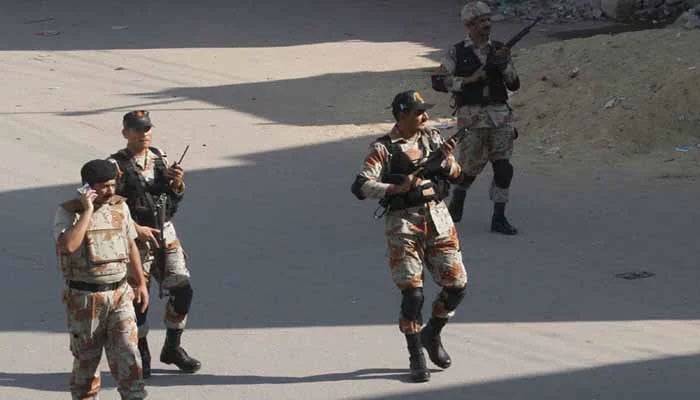 Rangers personnel patrolling a street in Karachi. — The News/File