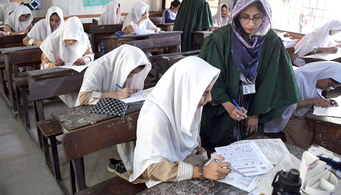 Students busy in solving their questioner during annual matriculation (9th and 10th grade) examinations under the Board of Secondary Education Karachi, in the Provincial Capital, Karachi on April 11, 2026. — Online