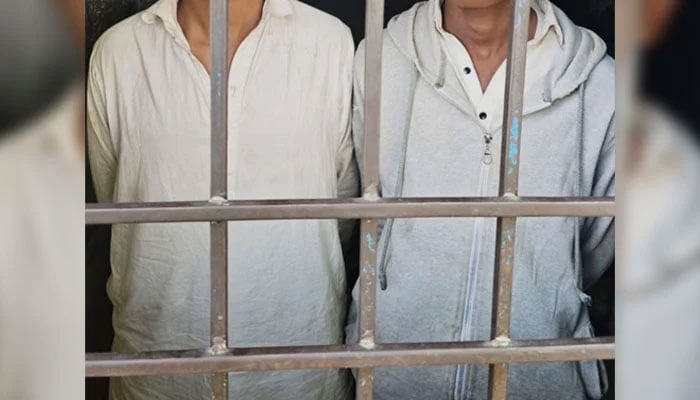 A representational image showing two arrested persons standing behind bars on January 4, 2025. — Facebook@KarachiPoliceOfficial