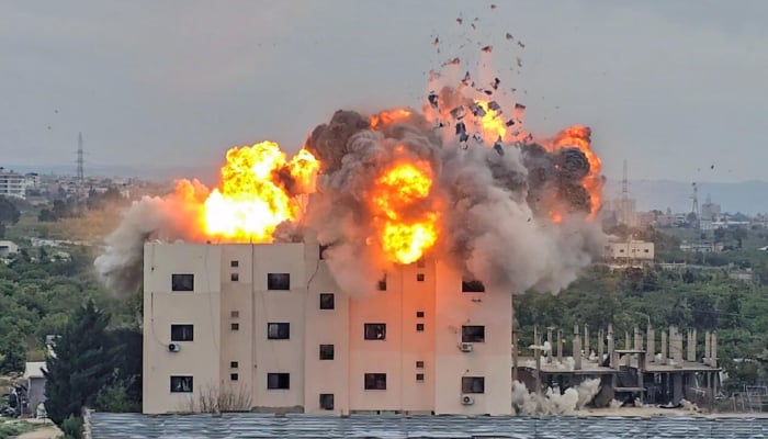 An Israeli airstike hits a building in Lebanon, in the southern village of Abbasiyyeh, on March 13, 2026.— AFP/File
