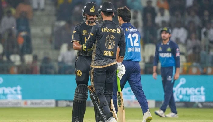 This representational image shows Peshawar Zalmis Babar Azam and Saim Ayub bump fists during their PSL 10 match against Multan Sultans at the Multan Cricket Stadium in Multan on May 5, 2025. — PCB