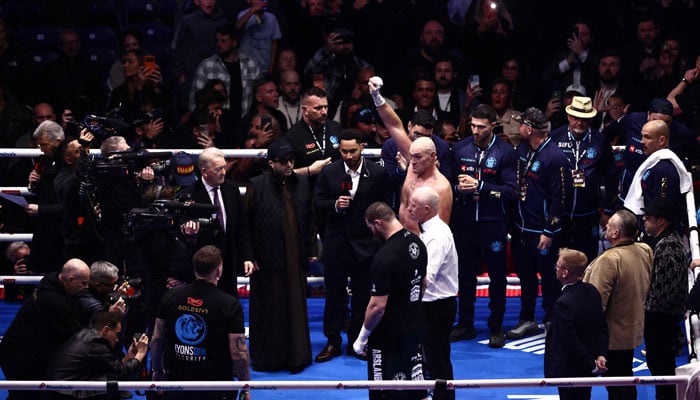 Britain’s Tyson Fury (centre) celebrates after his victory over Russia’s Arslanbek Makhmudov in their heavyweight ‘Clash of the Giants’ contest at the Tottenham Hotspur stadium in London on April 11, 2026. — AFP