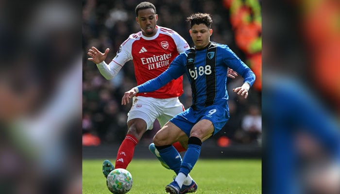 Arsenal’s Brazilian defender #06 Gabriel Magalhaes (left) challenges Bournemouth’s Brazilian striker #09 Evanilson  during the English Premier League football match between Arsenal and Bournemouth at the Emirates Stadium in London on April 11, 2026. — AFP
