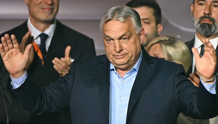 Hungarian Prime Minister Viktor Orban waves to supporters at the Balna centre in Budapest during Hungary´s general election on April 12, 2026.