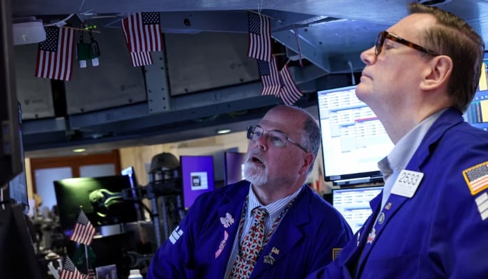 Traders work on the floor at the New York Stock Exchange (NYSE) in New York City, U.S., April 13, 2026.—Reuters