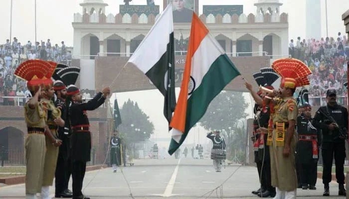 Pakistani and Indian soldiers take part in the flag-lowering ceremony at the Pak-India Wagah Border. — AFP/File
