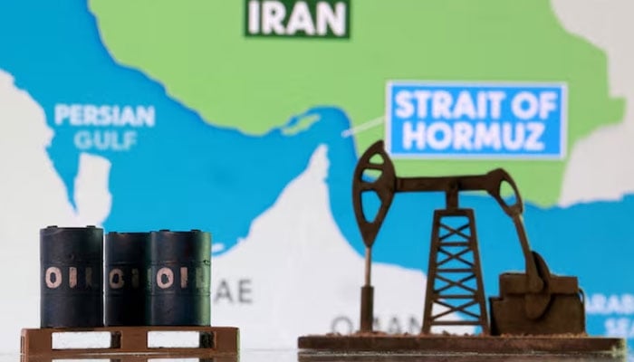 3D-printed oil barrels, an oil pump jack, and a map showing the Strait of Hormuz and Iran appear in this illustration taken March 2, 2026.—Reuters