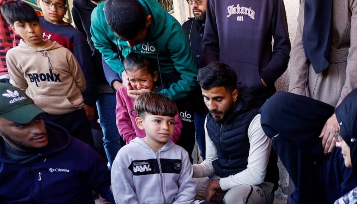 Mourners react during the funeral of Palestinians who were killed in an Israeli strike, according to medics, at Al-Aqsa Martyrs Hospital in Deir al-Balah, central Gaza Strip, April 13, 2026.—Reuters