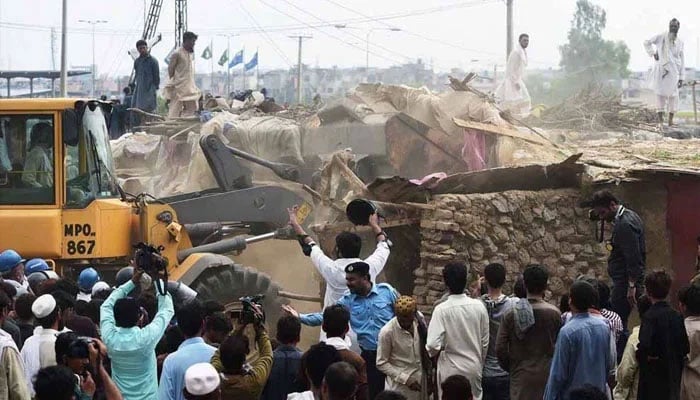 The representational image shows the CDA officials demolishing katchi abadis in Islamabad. — The News/File