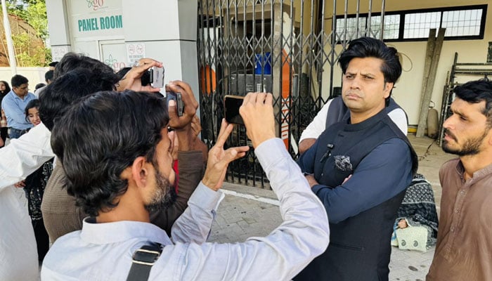Special Assistant to the Chief Minister on Information and Public Relations, Shafiullah Jan talking to reporters outside the Adiala jail on April 14, 2026. — Facebook@Shafijanpti