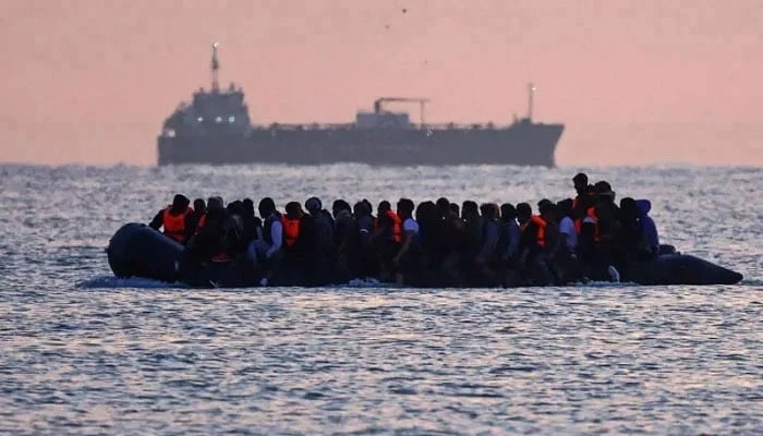 Undated handout photo shows migrants aboard a boat. — Reuters/File