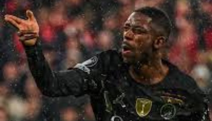 Ousmane Dembele can be seen celebrating. —AFP/File