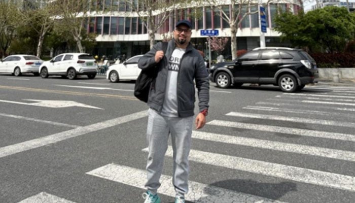 Dr Sami Iqbal seen in front of his office building in Nanjing.  — CEN/File