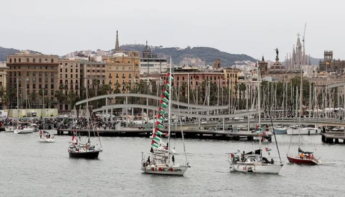 The Sagrada Familia basilica appears in the distance as boats taking part in a humanitarian flotilla depart for Gaza from Barcelona, Spain, April 12, 2026.—Reuters