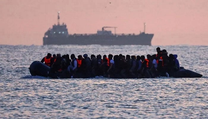 Undated handout photo shows migrants aboard a boat. — Reuters/File