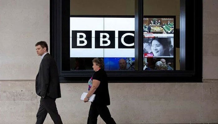 An undated image shows screens showing broadcasts are seen through a window at the BBC headquarters of New Broadcasting House in London, UK. — Reuters/File