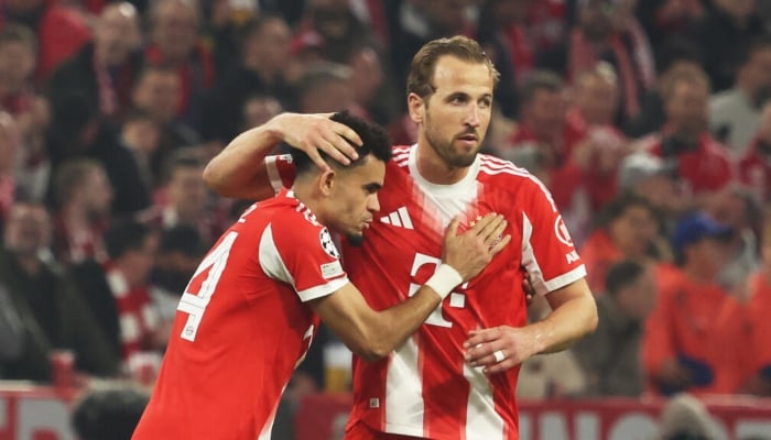 Bayern Munich forward Harry Kane celebrates with winger Luis Diaz in Wednesdays win over Real Madrid. —AFP