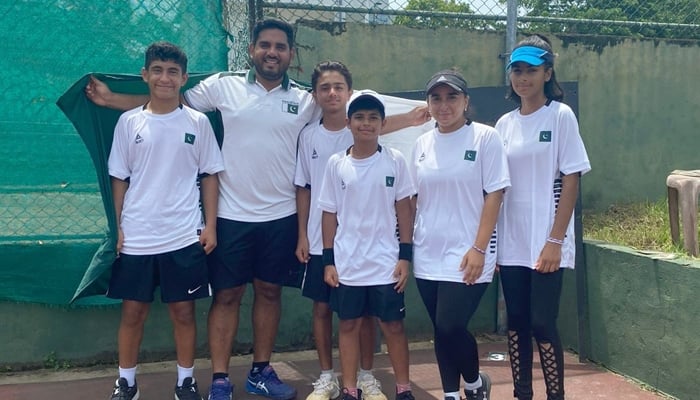 Pakistans under-12 tennis team poses for a group photo. — PTF/File