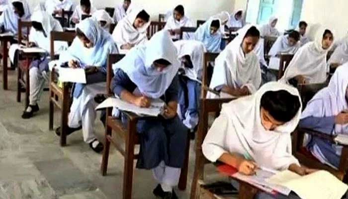 The representational image shows students appearing in exams. -APP/File