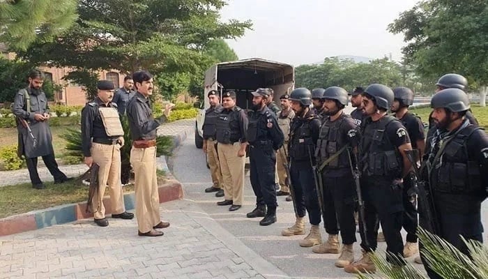 KP police officer interacts with the personnel in this image, released on November 8, 2023. — Facebook@pakhtunkhwapolice