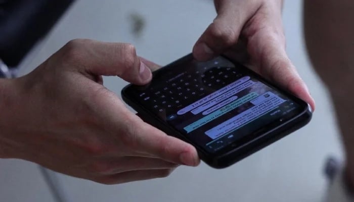 This representational image shows a person chatting on WhatsApp. — Unsplash/File