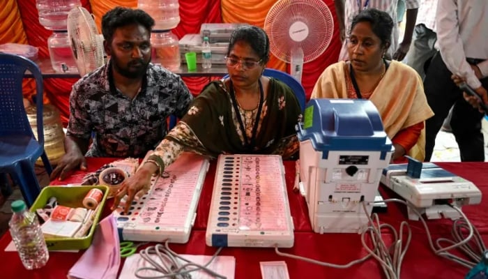 Poll officials prepare and install candidate names and symbols in Electronic Voting Machines (EVMs) in Chennai on April 16, 2026 ahead of the Tamil Nadu Legislative Assembly election. — AFP