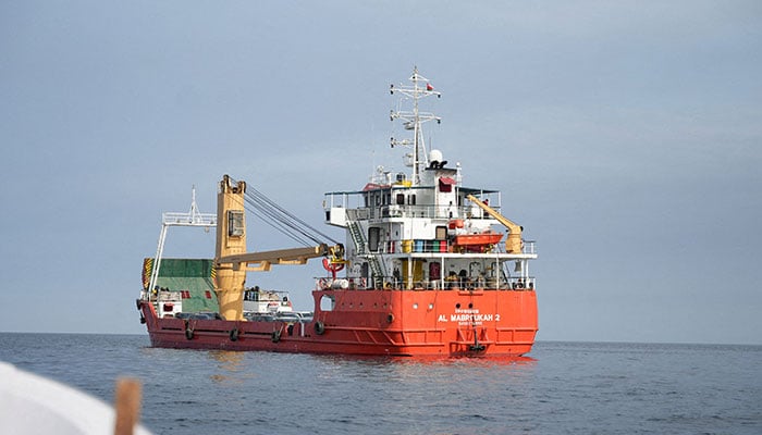 A vessel at the Strait of Hormuz, off the coast of Oman’s Musandam province, April 12, 2026. — Reuters