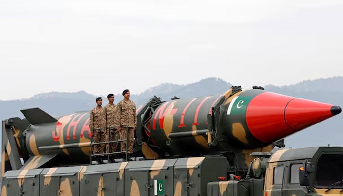 Pakistani military personnel stand beside a Shaheen III surface-to-surface ballistic missile during Pakistan Day military parade in Islamabad, March 23, 2019. — Reuters