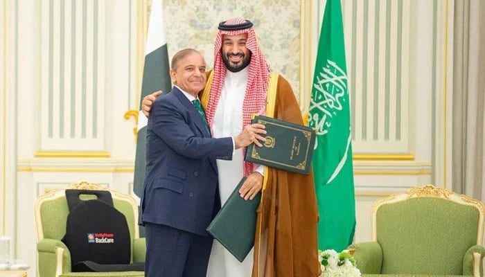 Prime Minister Shehbaz Sharif and Saudi Crown Prince Mohammed bin Salman embrace each other on the day they sign a defence agreement, in Riyadh, Saudi Arabia, September 17, 2025. — Reuters