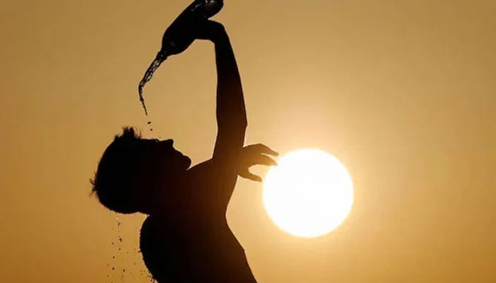 This representational image shows a runner cools down with water in Skopje, North Macedonia July 12, 2023. — Reuters