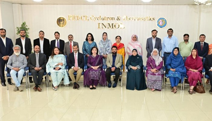 The image shows the group photo at the the Institute of Nuclear Medicine and Oncology (INMOL), Atomic Energy Cancer Hospital, Lahore. — APP/File