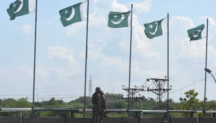 Security personnel stand at Zero Point Bridge in a high security area as Pakistan gears up to host the US and Iran for peace talks, in Islamabad, April 9, 2026. — Reuters