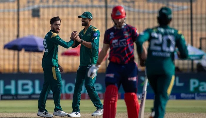 Multan Sultans spinner Arafat Minhas (left) celebrates after dismissing Salman Ali Agha during their Pakistan Super League (PSL) 11 match against Karachi Kings at the National Bank Stadium in Karachi on April 19, 2026. — PSL