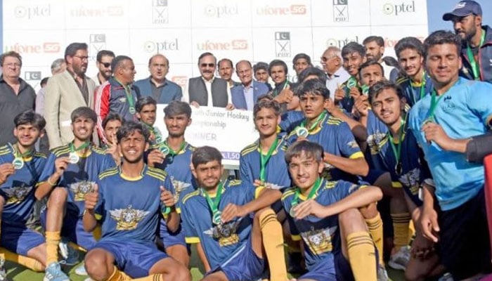 Pakistan Customs under-18 hockey team poses for a group photo after winning the National Under-18 Hockey Championship on April 19, 2026. — APP