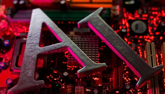 AI (Artificial Intelligence) letters are placed on computer motherboard in this illustration taken, June 23, 2023. — Reuters