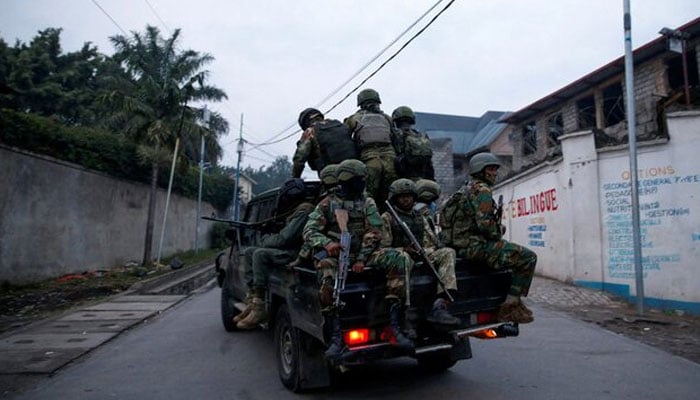 Members of the M23 rebel group ride on a pickup truck as they leave their position for patrols amid conflict between them and the Armed Forces of the Democratic Republic of the Congo (FARDC), in Goma, eastern Democratic Republic of the Congo. Reuters/File