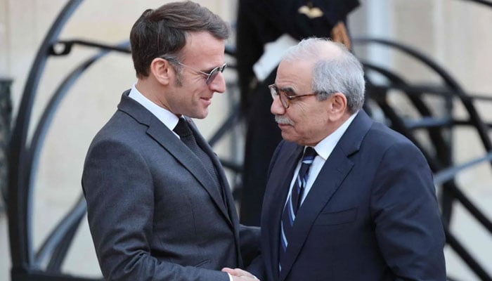 French President Emmanuel Macron (left) welcomes Lebanese Prime Minister Nawaf Salam at the Elysee Palace in Paris during the latter’s official visit to France. — AFP/File