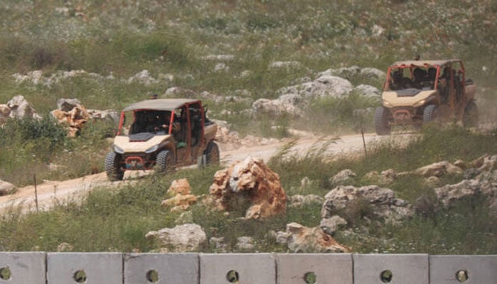 Israeli military vehicles drive in southern Lebanon, near the Israel-Lebanon border, amid a 10-day ceasefire between Lebanon and Israel, as seen from Israel, April 19, 2026. — Reuters