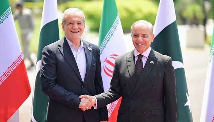 Prime Minister Shehbaz Sharif (right) receives Iranian President Dr Masoud Pezeshkian at the Prime Ministers House, Islamabad, on August 3, 2025. — X/@GovtofPakistan