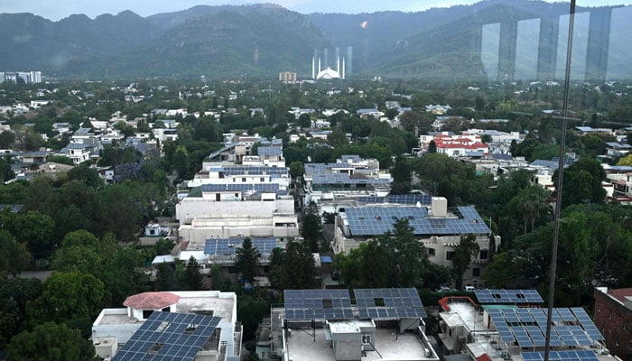 An overall view of the Islamabad landscape with solar panel seen installed on rooftops, on April 17, 2026. — AFP