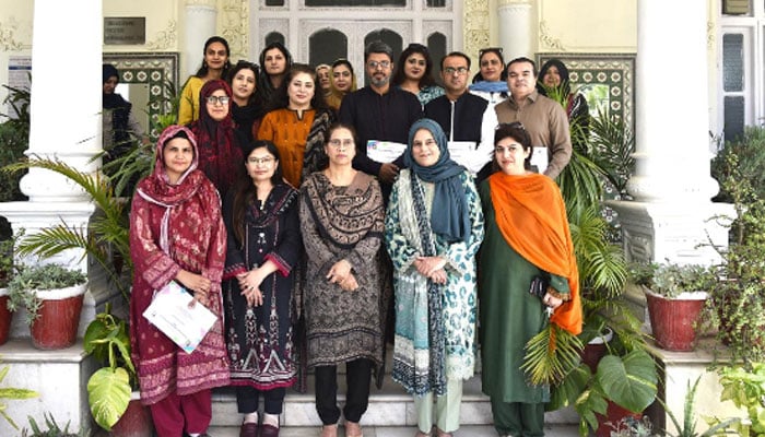The image shows a certificate distribution ceremony at Fatima Jinnah Women University (FJWU) in Rawalpindi, April 14, 2026. — APP