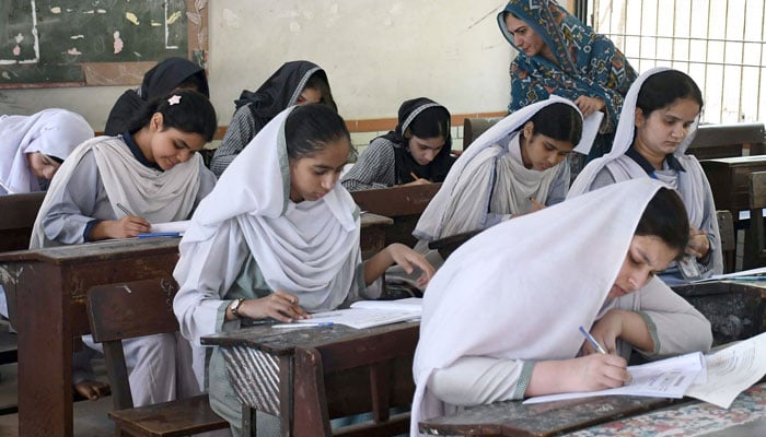 Students busy in solving their questioner during annual matriculation (9th and 10th grade) examinations under the Board of Secondary Education Karachi, in Karachi on April 10, 2026. — ONLINE